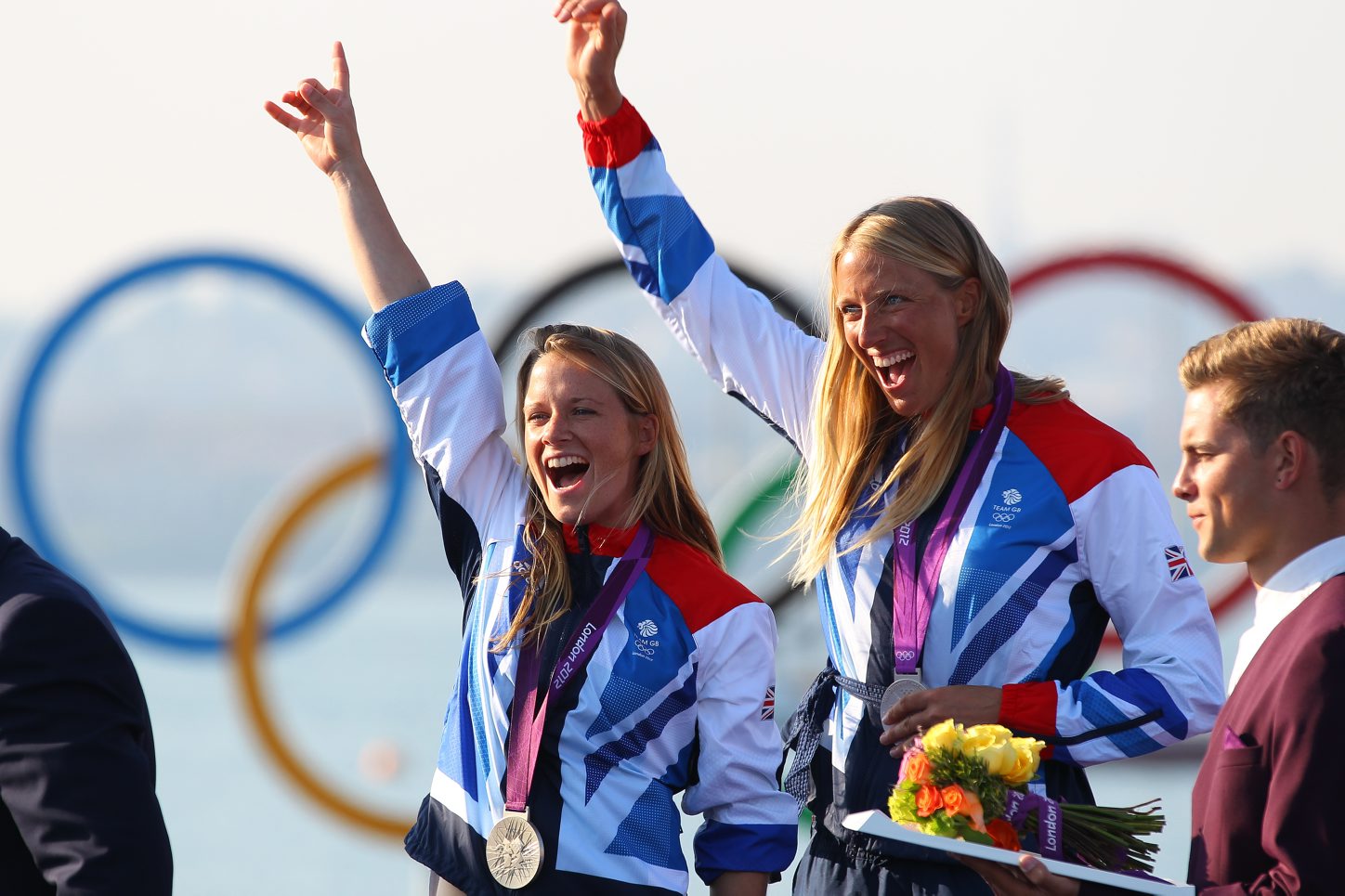 Hannah Mills (left) sails to silver with Saskia Clark