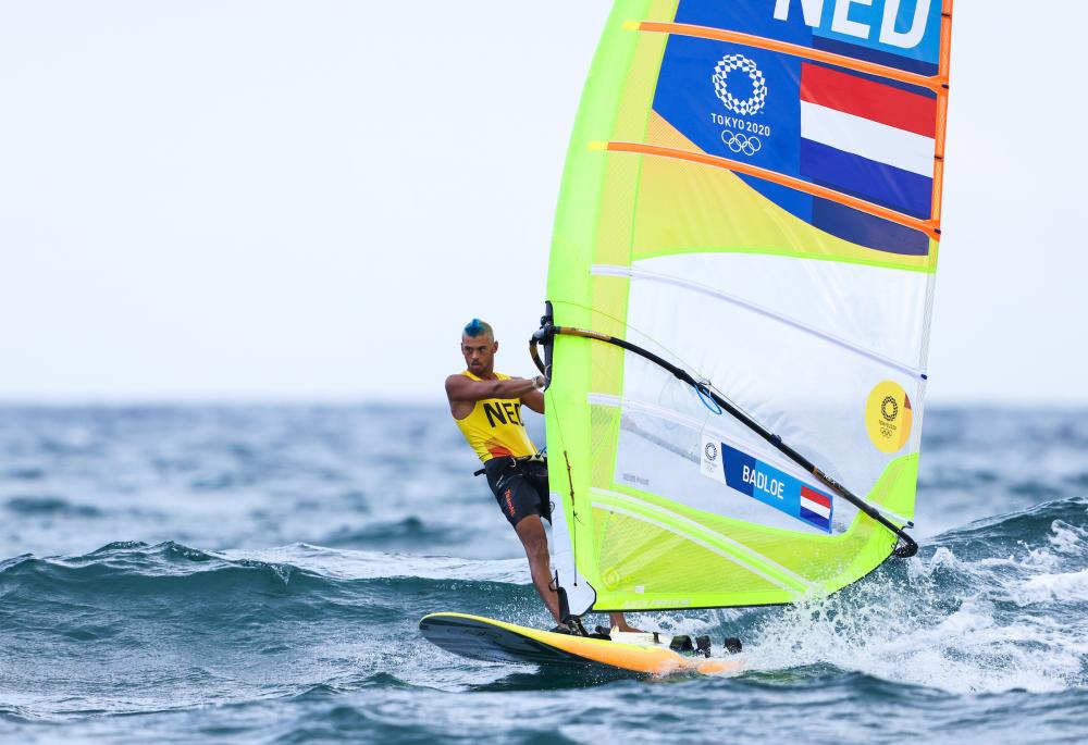Flying Dutchman with one hand on RS:X Windsurfer gold