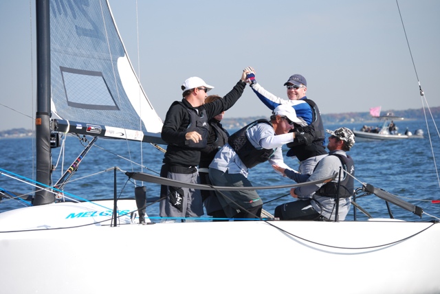 Terry Hutchinson high-fiving after a Melges victory